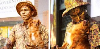 Cachorrinha ajuda seu pai humano fazendo estátua viva junto com ele Cachorrinha ajuda seu pai humano fazendo estátua viva junto com ele